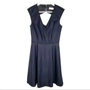Trina Turk black and blue sleeveless V neck knee length A line dress size 4
